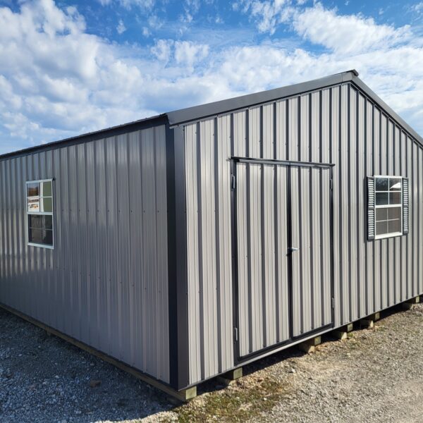 Metal storage shed on gravel foundation