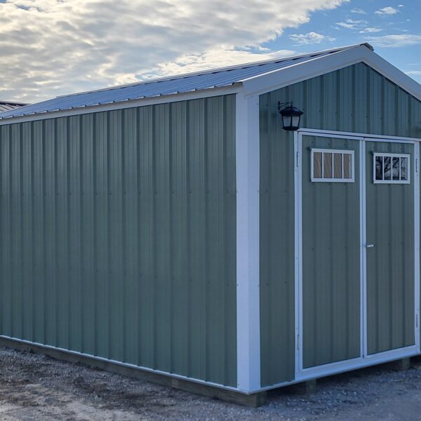 Metal storage shed with green exterior