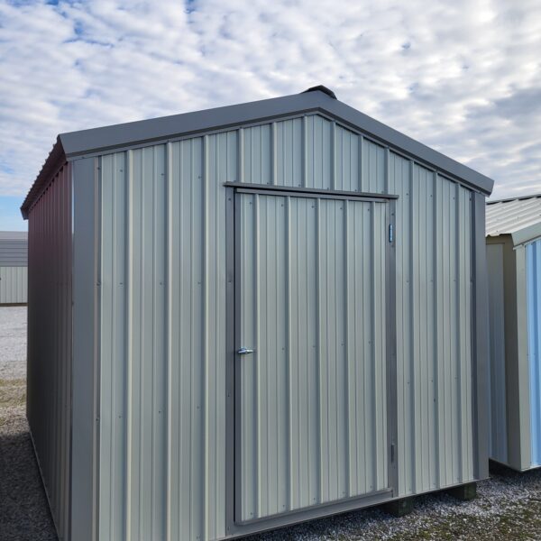 Metal storage shed against cloudy sky