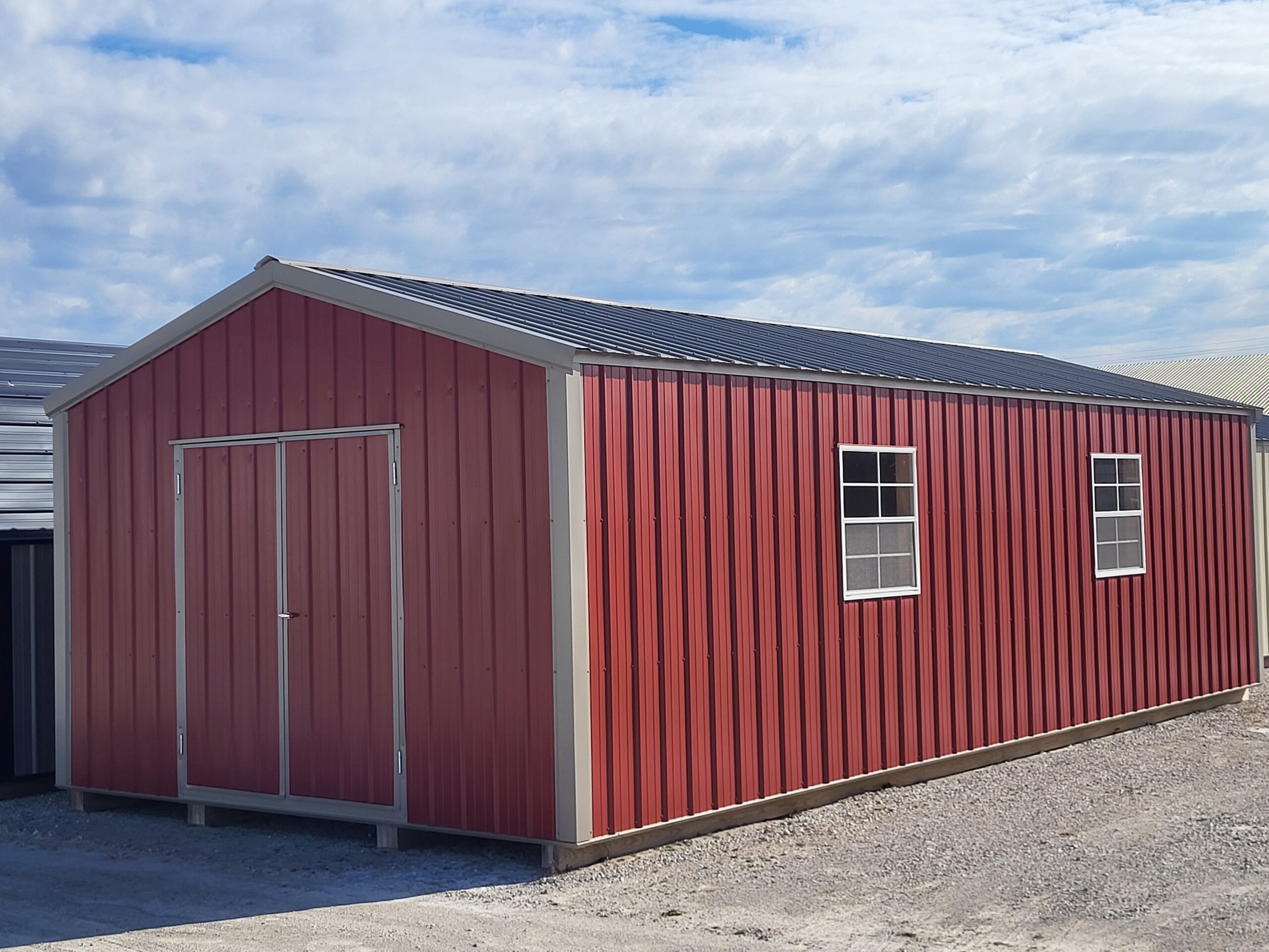 Red metal storage shed outdoors