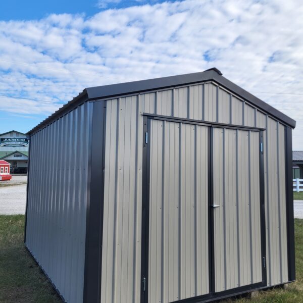 Metal storage shed under blue sky