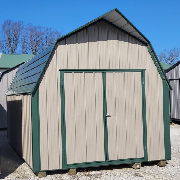 Metal storage shed with green trim