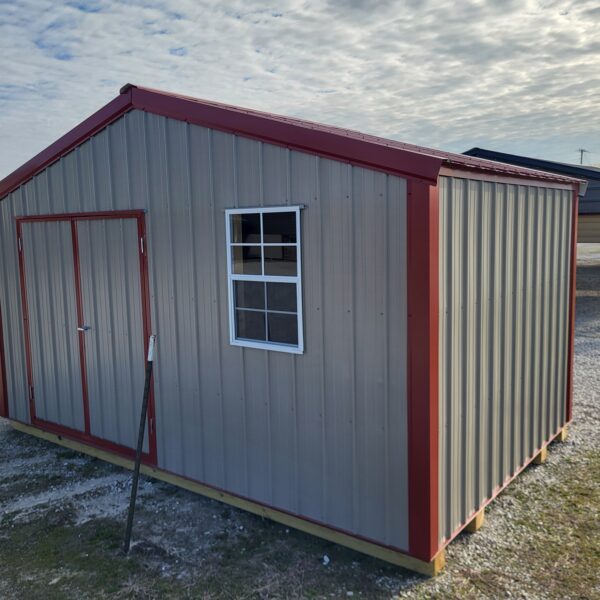 Metal shed with red roof and trim