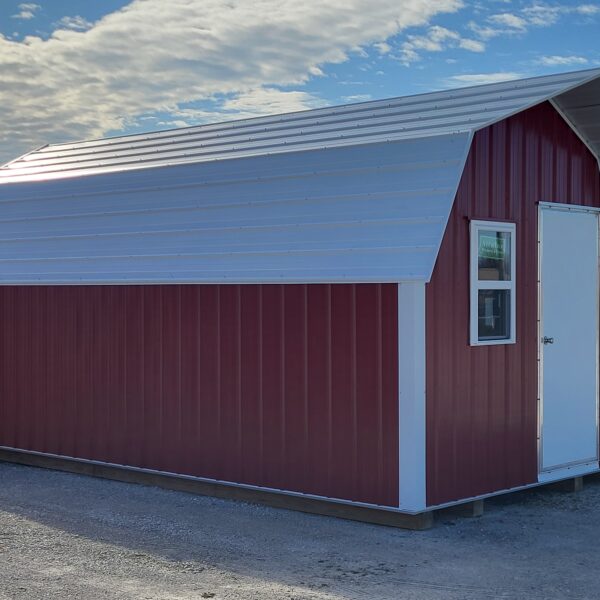 Red and white metal storage shed